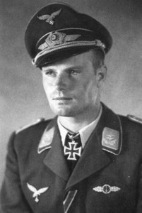 Franz Götz in a portrait photo with his medals and awards.