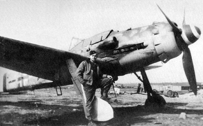 A German pilot posing close to his FW-190D.