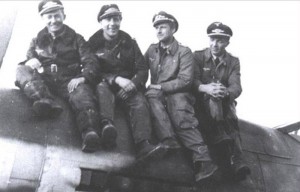 Hauptmann Wübke (the second from left to right) with other pilots sitting on Red 3.
