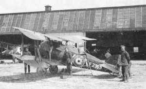 A Snipe in maintenance, with the mechanics working on the aircraft.