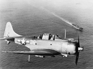 SBD-5 of US Navy VB-10 squadron, above the USS Enterprise, in the Pacific (1944).
